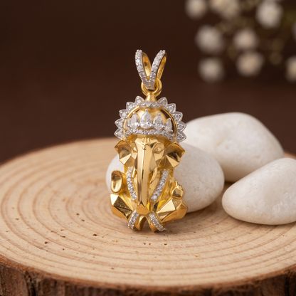 Radiant Ganesh silver pendant shown in hand for scale